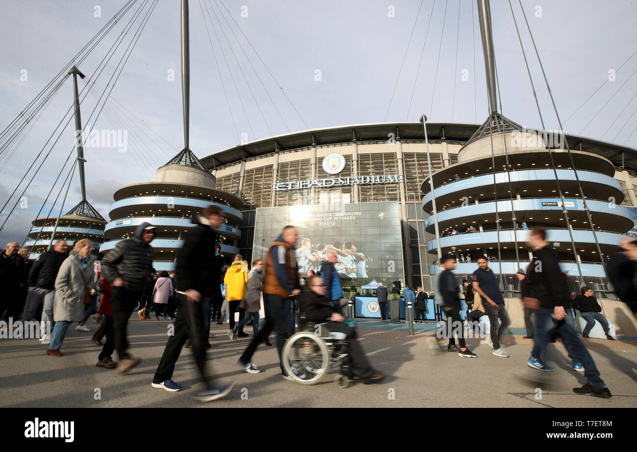 Fans arrive for the Premier League match at the Etihad Stadium, Manchester. Stock Photo