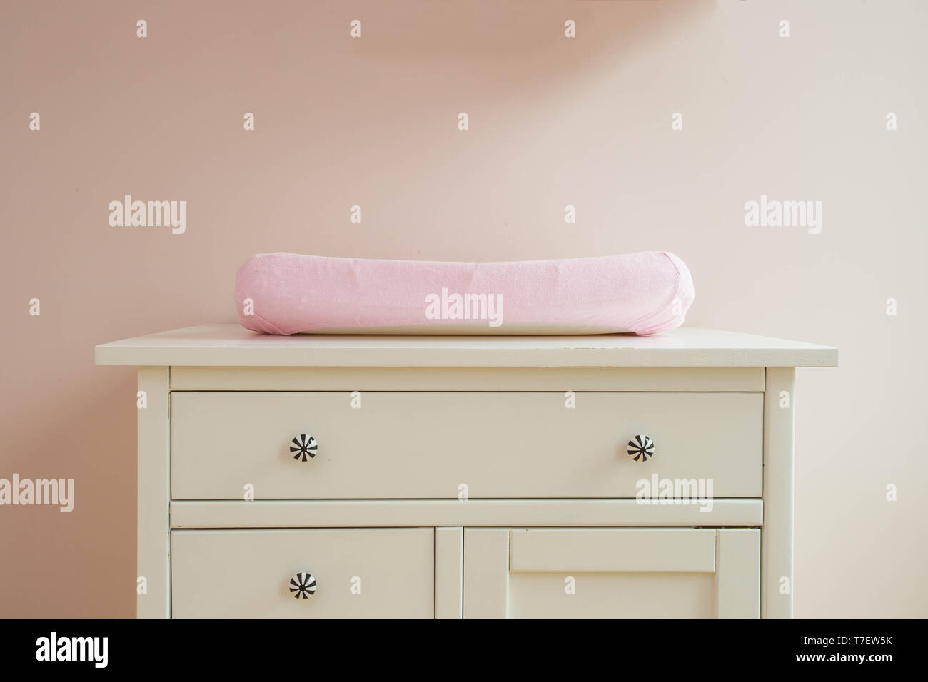 Changing mat in baby room modern design, pink colors Stock Photo Alamy