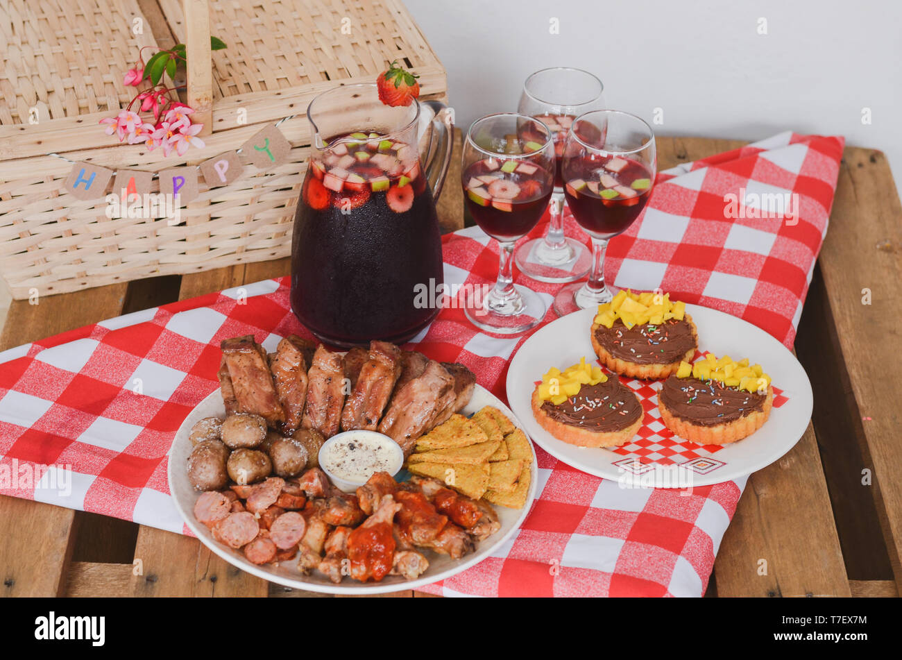 https://c8.alamy.com/comp/T7EX7M/food-and-drinks-picnic-on-rustic-wooden-table-with-checkered-tablecloth-T7EX7M.jpg