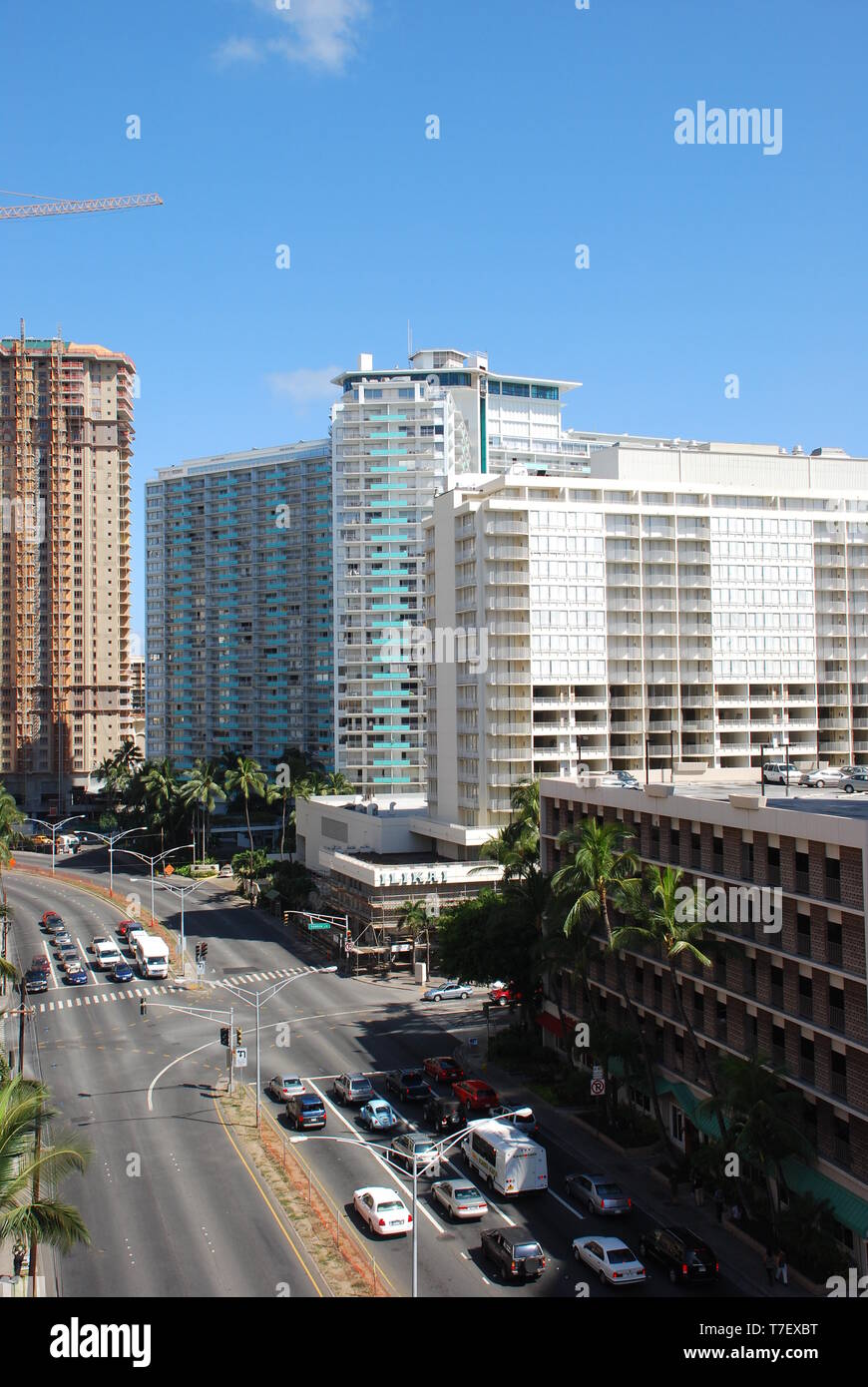 cars driving through city tall buildings waikiki oahu hawaii hawaiian