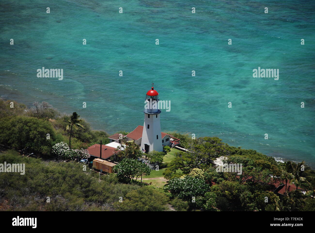 Diamond head lighthouse Oahu Hawaii clear blue ocean water Hawaiian Island Stock Photo
