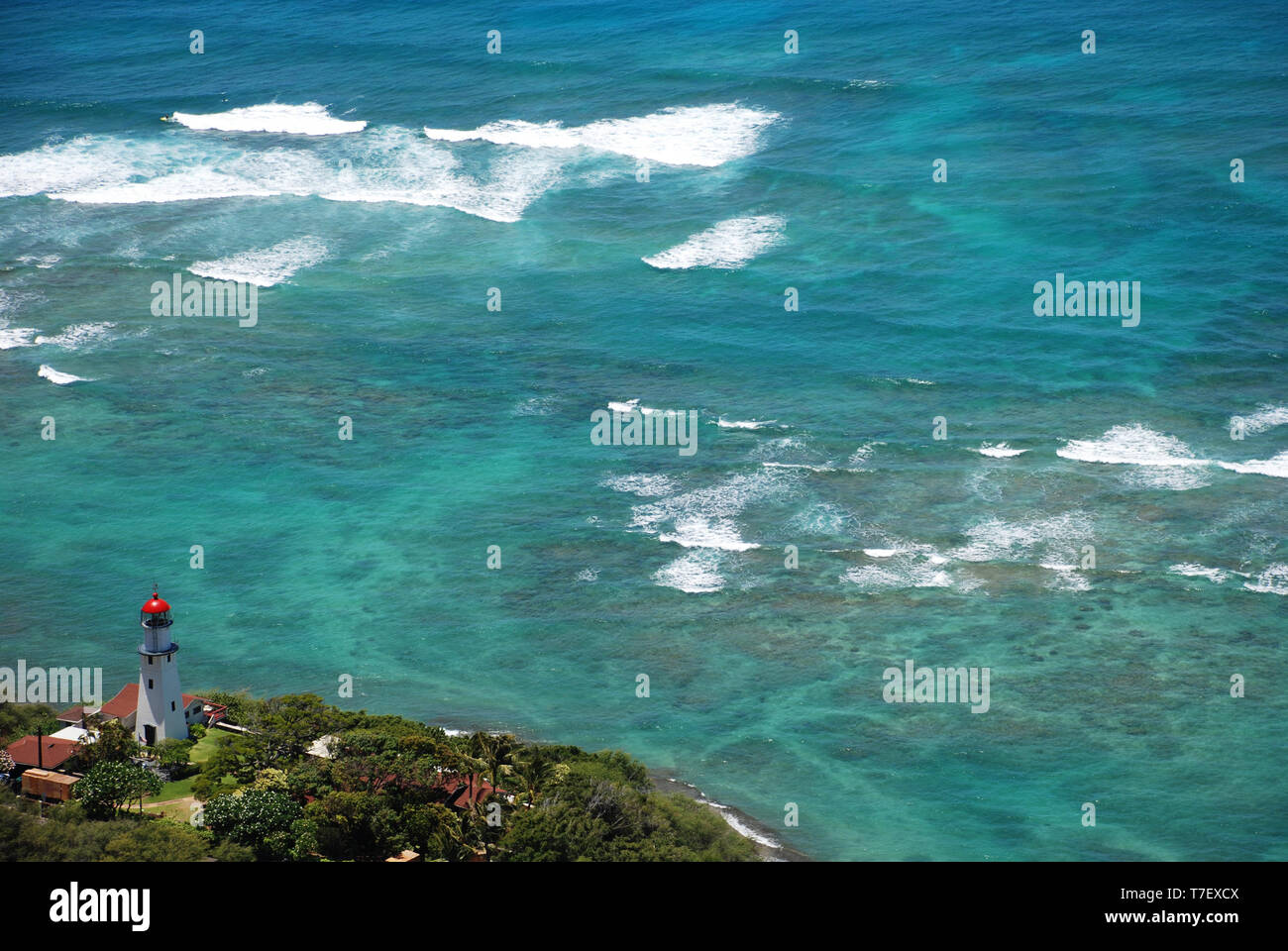 Diamond head lighthouse Oahu Hawaii clear blue ocean water Hawaiian Island Stock Photo