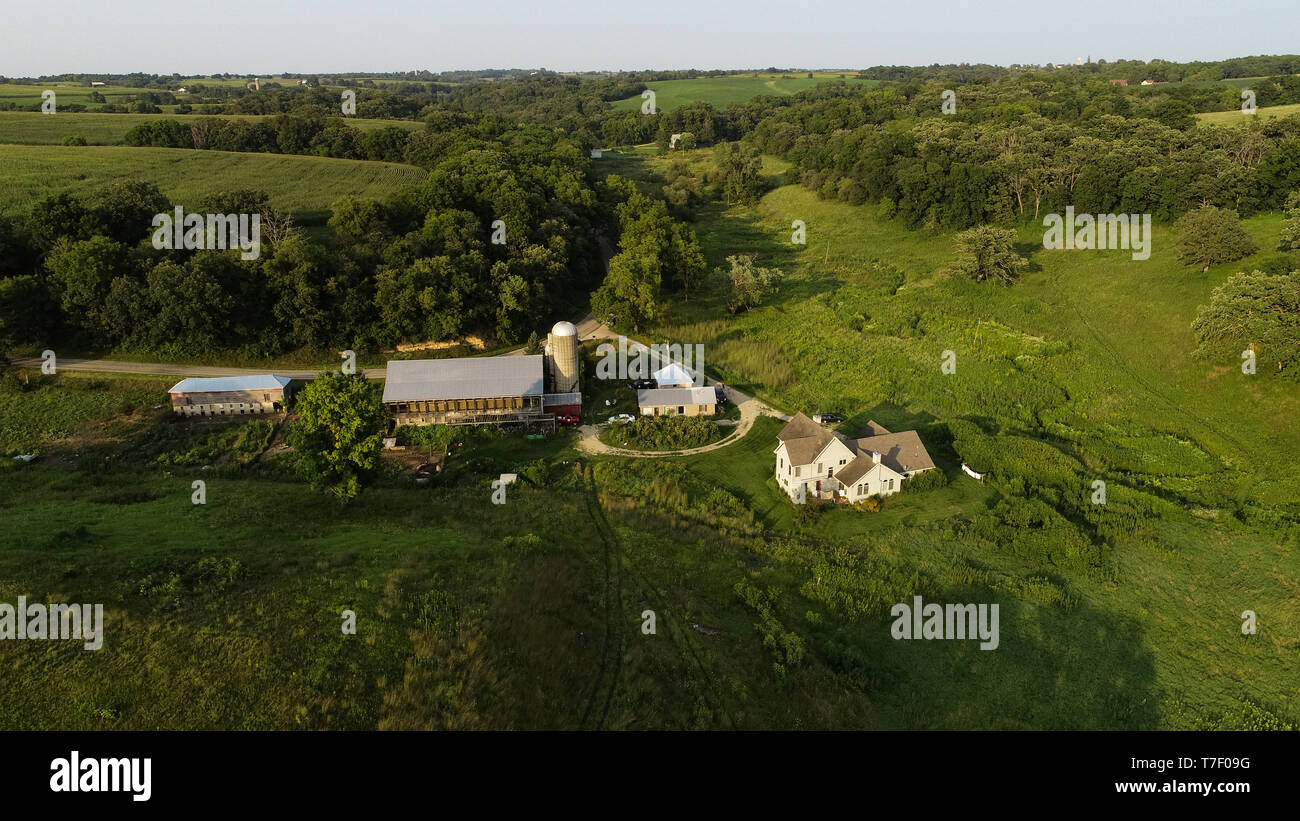 Aerial view from drone of working farm at sunset with Gloucester Old