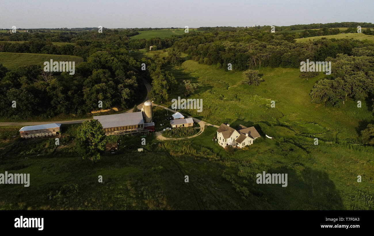 Aerial view from drone of working farm at sunset with Gloucester Old