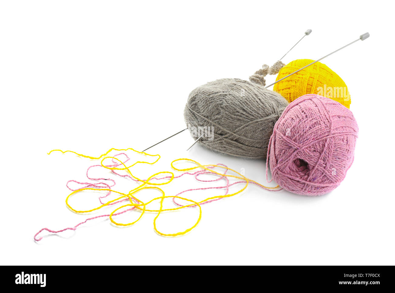 Knitting yarn with needles on white background Stock Photo - Alamy