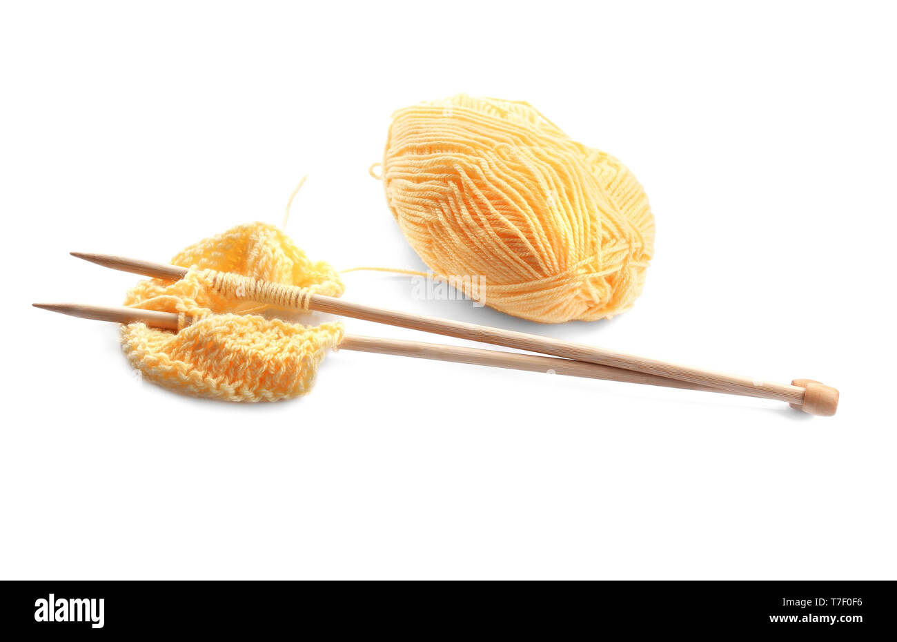 Knitting yarn with needles on white background Stock Photo - Alamy