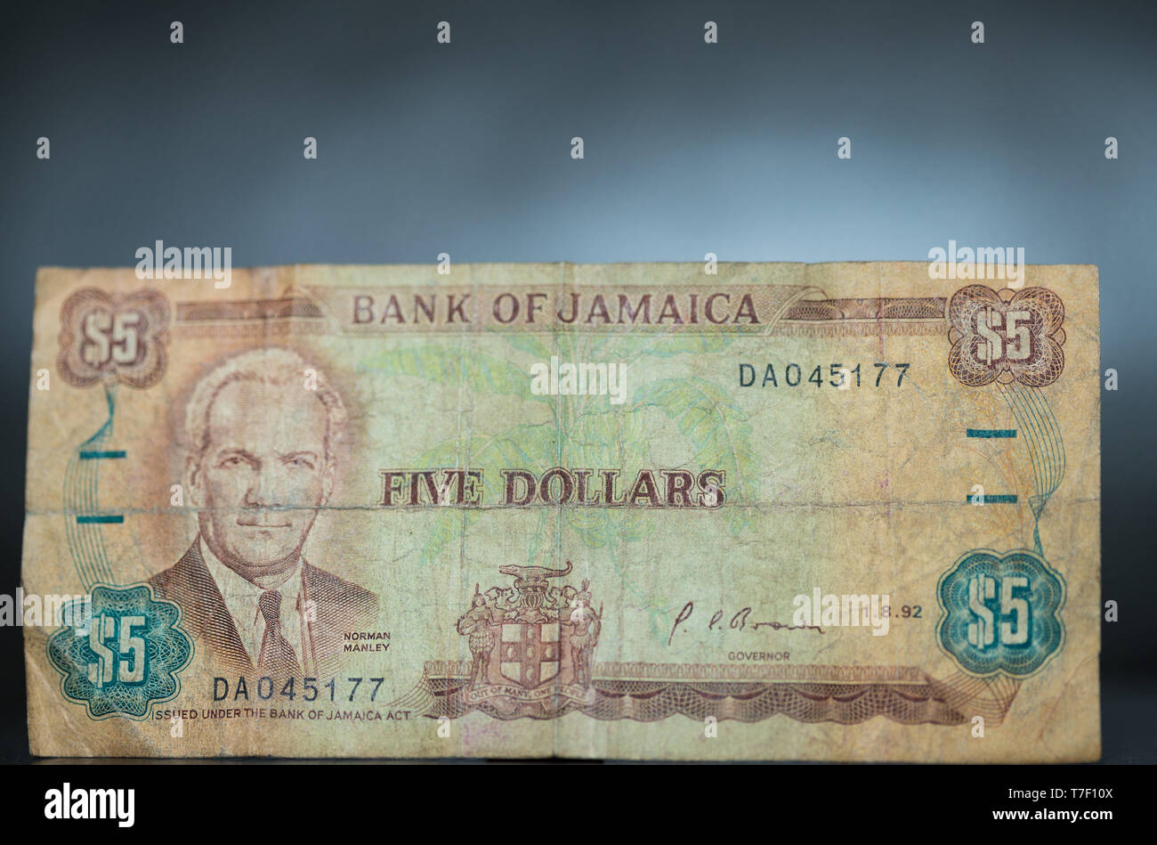 Toronto, Ontario / Canada - April 2019: An  old out of circulation Jamaican Five Dollar Bill displaying The Right Excellent Norman Washington Manley Stock Photo