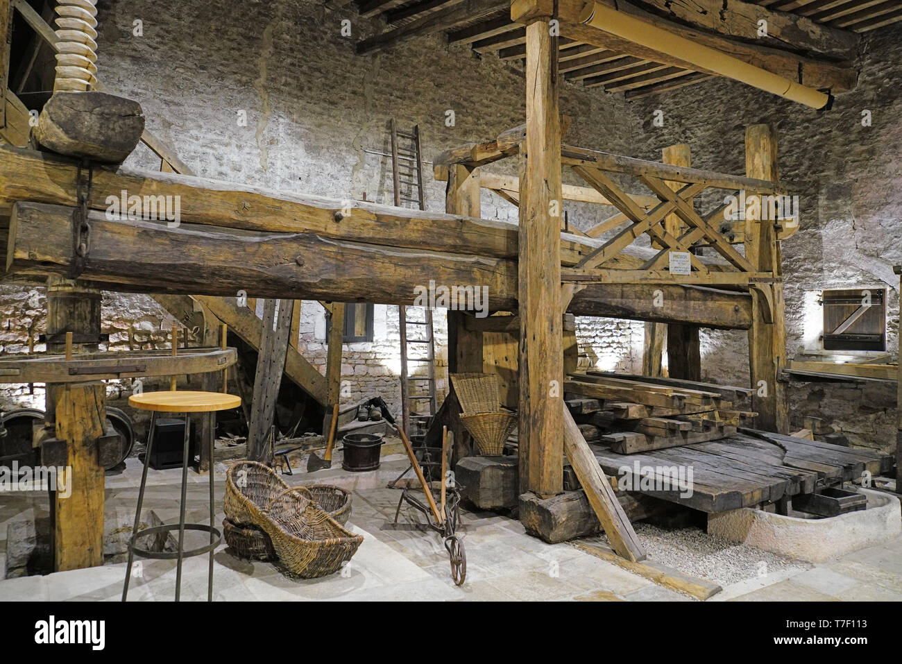 Giant wooden wine press pre-WW I at Domaine Larouche winery Stock Photo