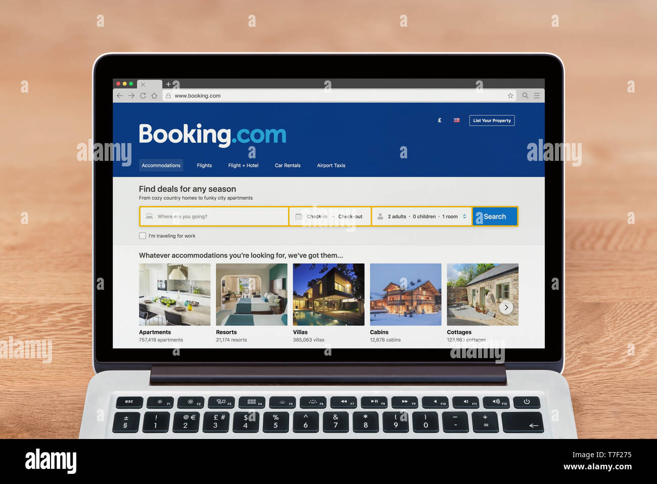 An Apple Macbook displays the Booking.com website (Editorial use only). Stock Photo