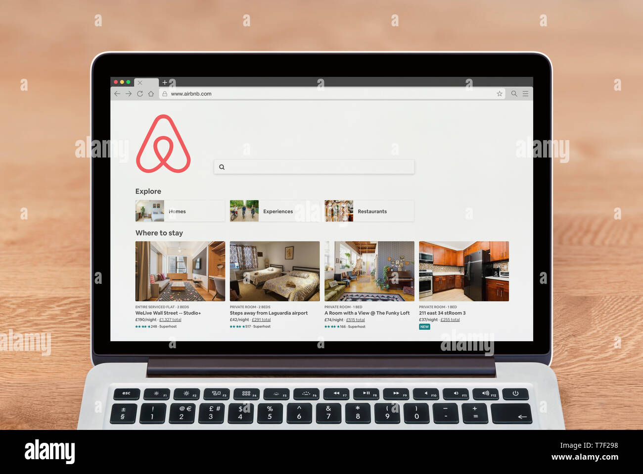 An Apple Macbook displays the Airbnb website (Editorial use only Stock