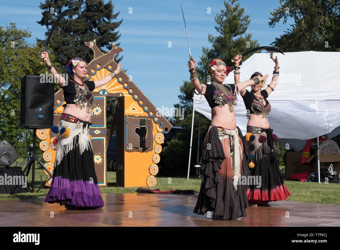 Belly dancers perform at the Maslenitsa Multicultural Festival in Eugene, Oregon, USA. Stock Photo
