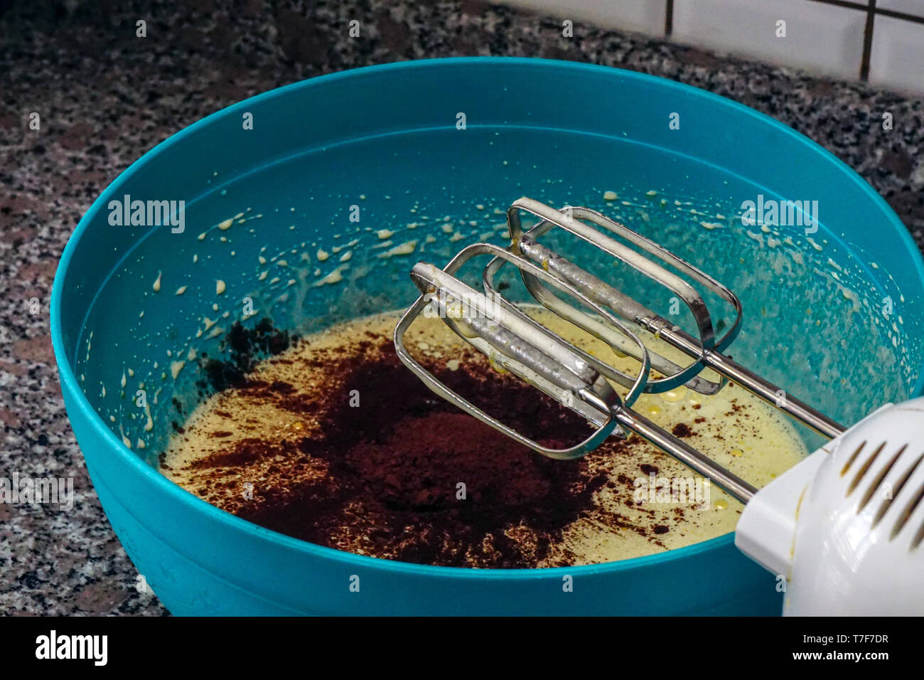 Preparing brownie cake at home with mixer whisk and oven processes