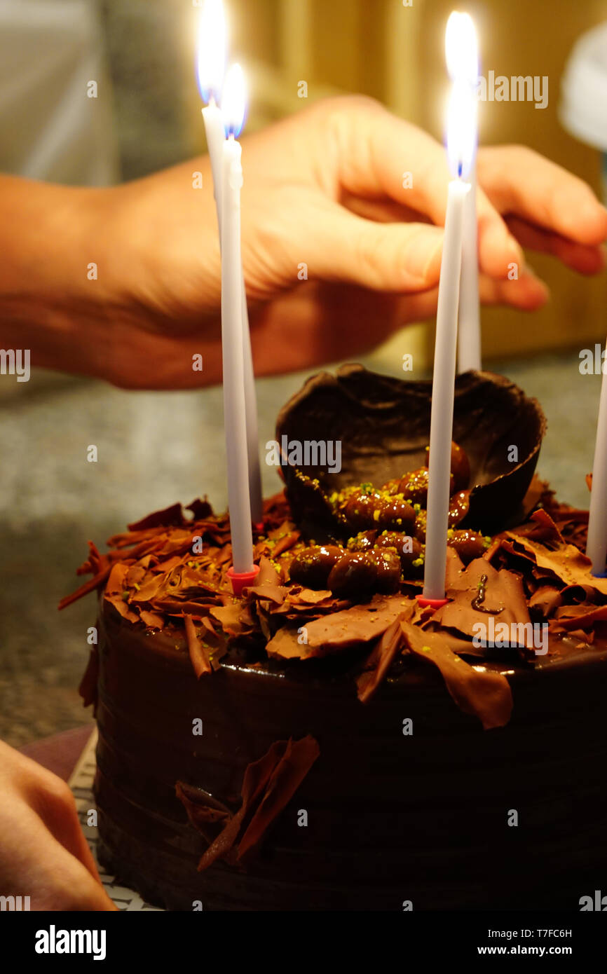 Birthday celebration chocolate cake with candles on Stock Photo - Alamy