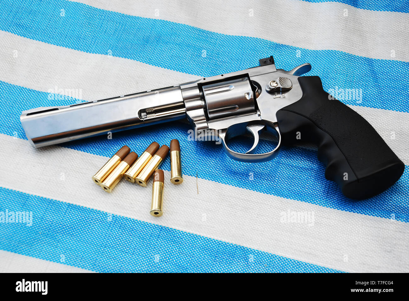 Airgun on white blue background close up view Stock Photo
