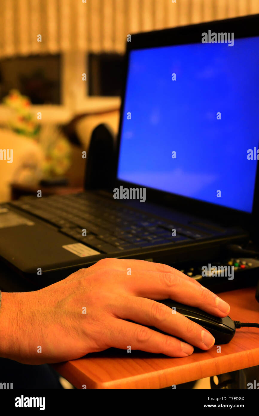 Senior hand using laptop close up view Stock Photo