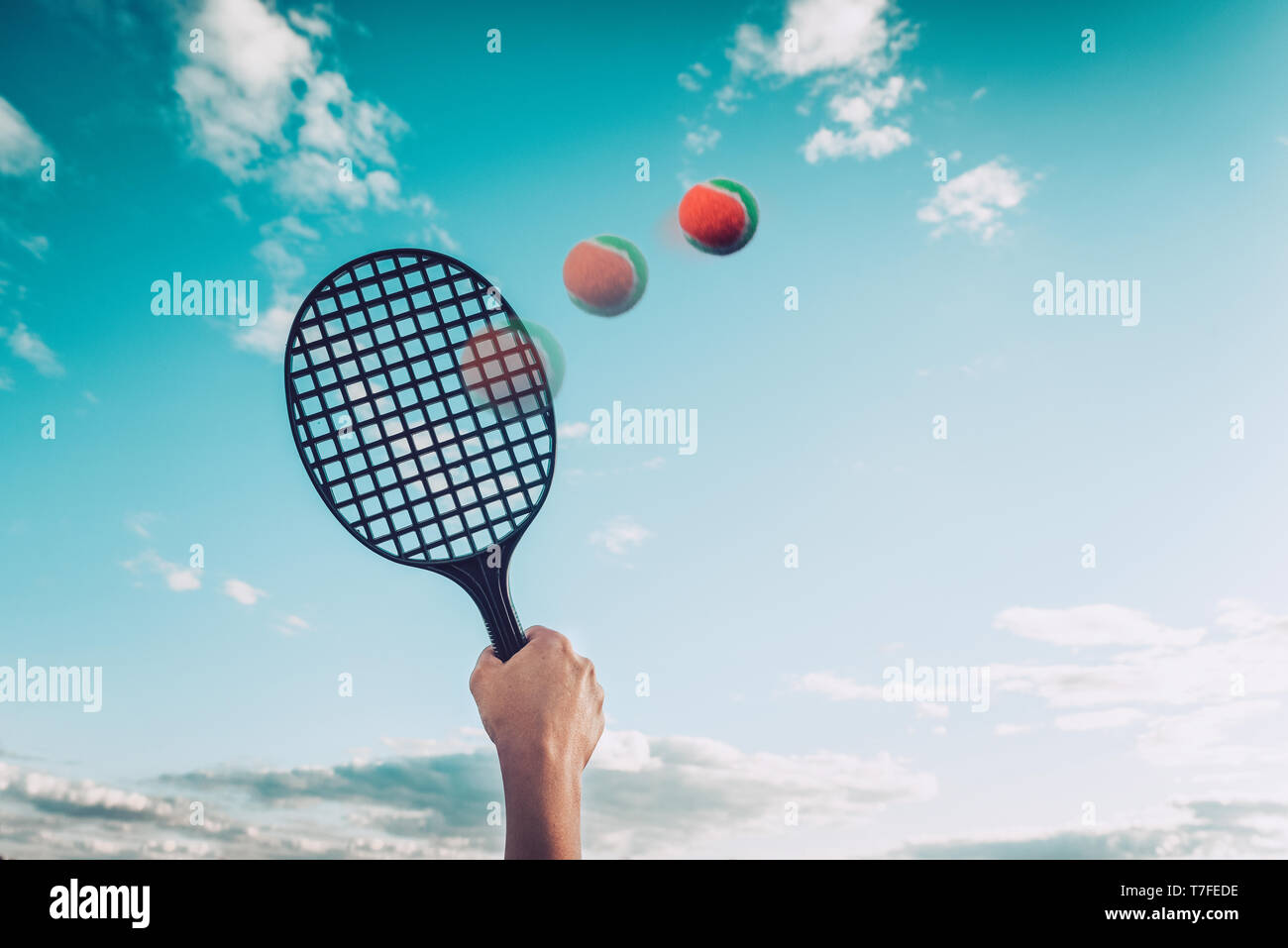 Summer game of badminton or beach tennis against the sky. Concept of summer  family entertainment Stock Photo - Alamy