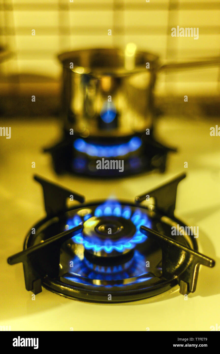 Natural gas flames on the oven burner close up view Stock Photo Alamy