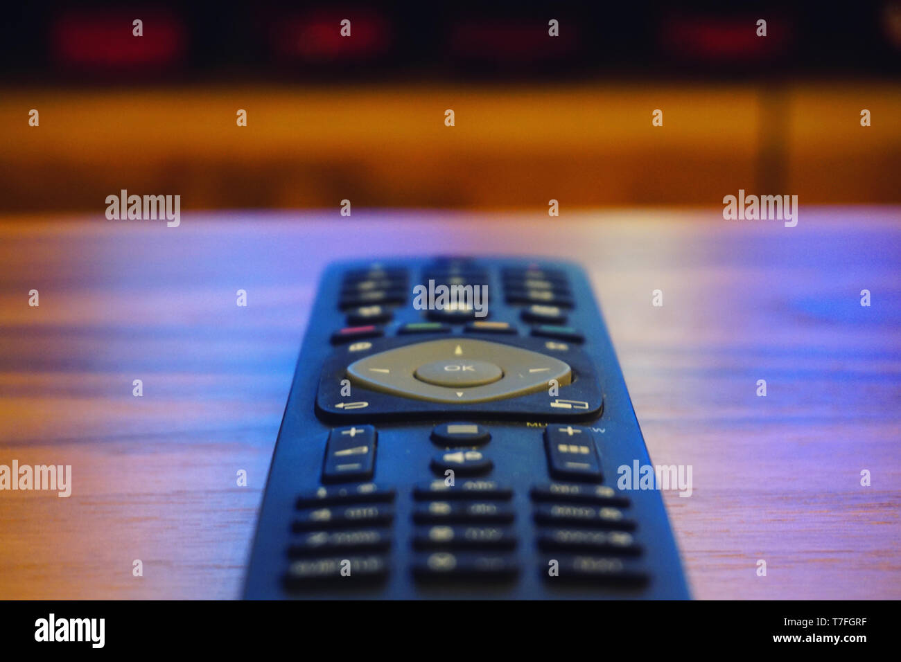 Remote controller on wooden background Stock Photo - Alamy