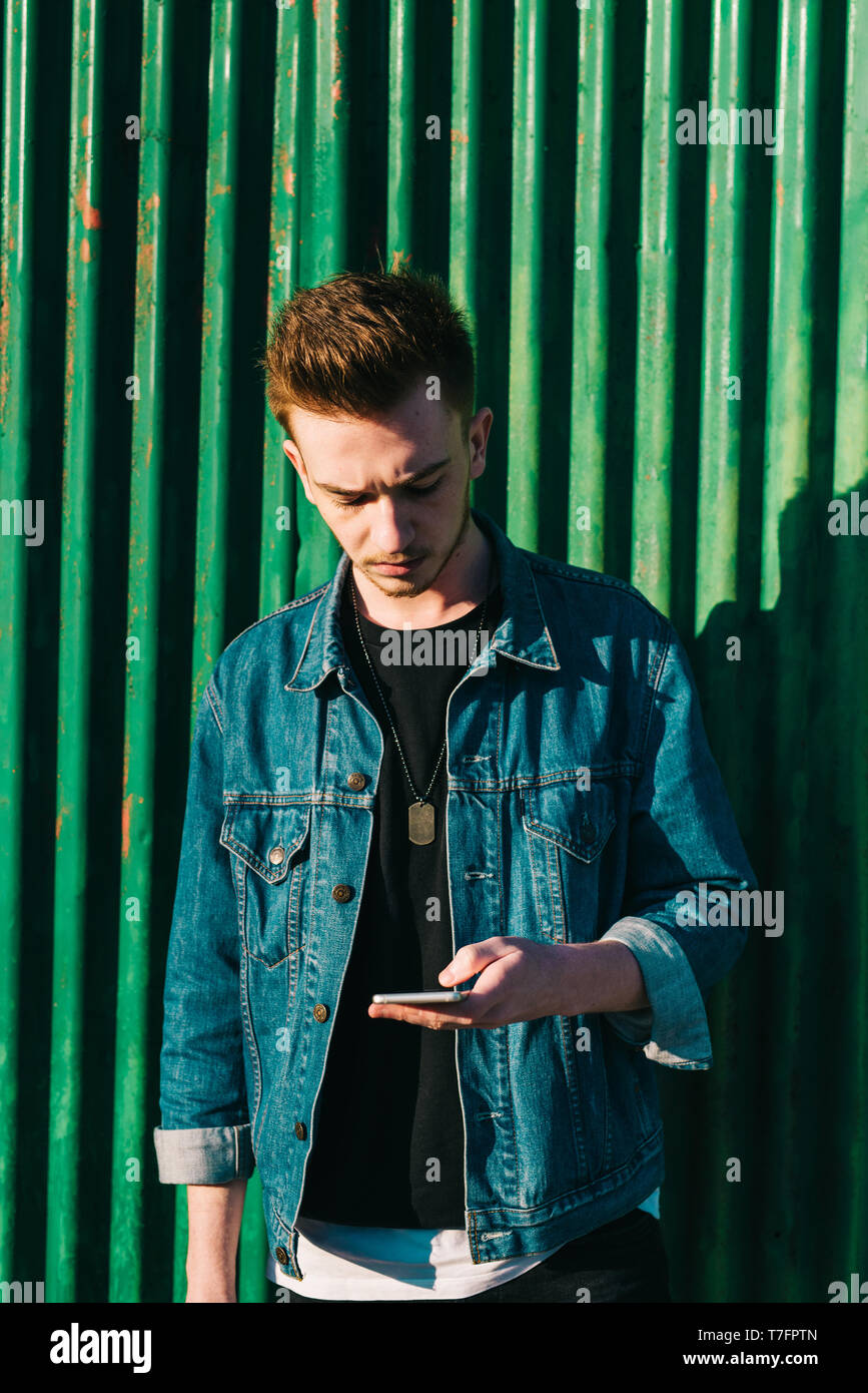 Young man using smartphone Stock Photo