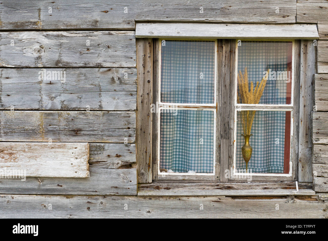 Window, widow of wooden house with curtain Stock Photo
