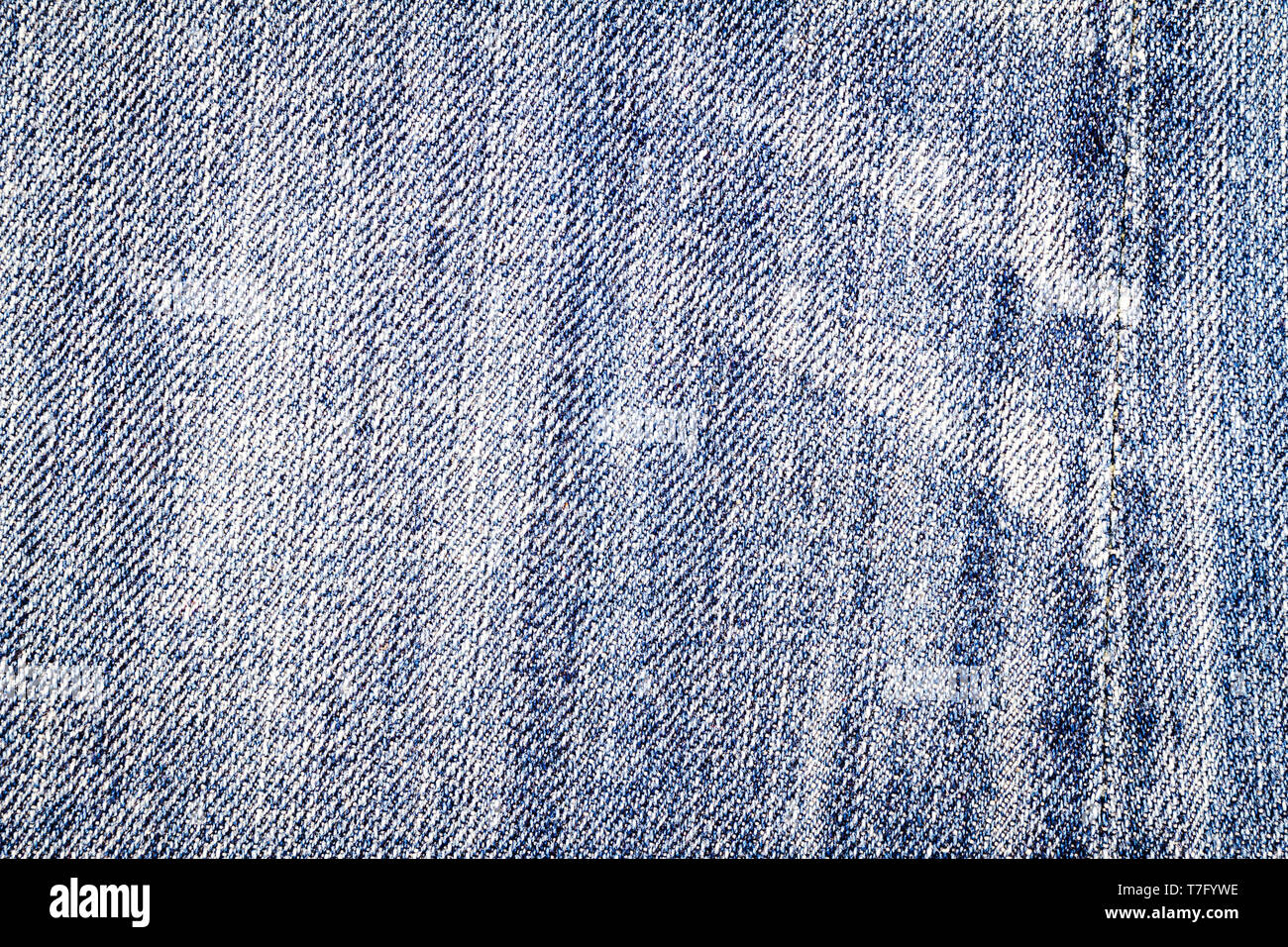 Light blue jeans texture. Denim fabric background with a seam Stock ...