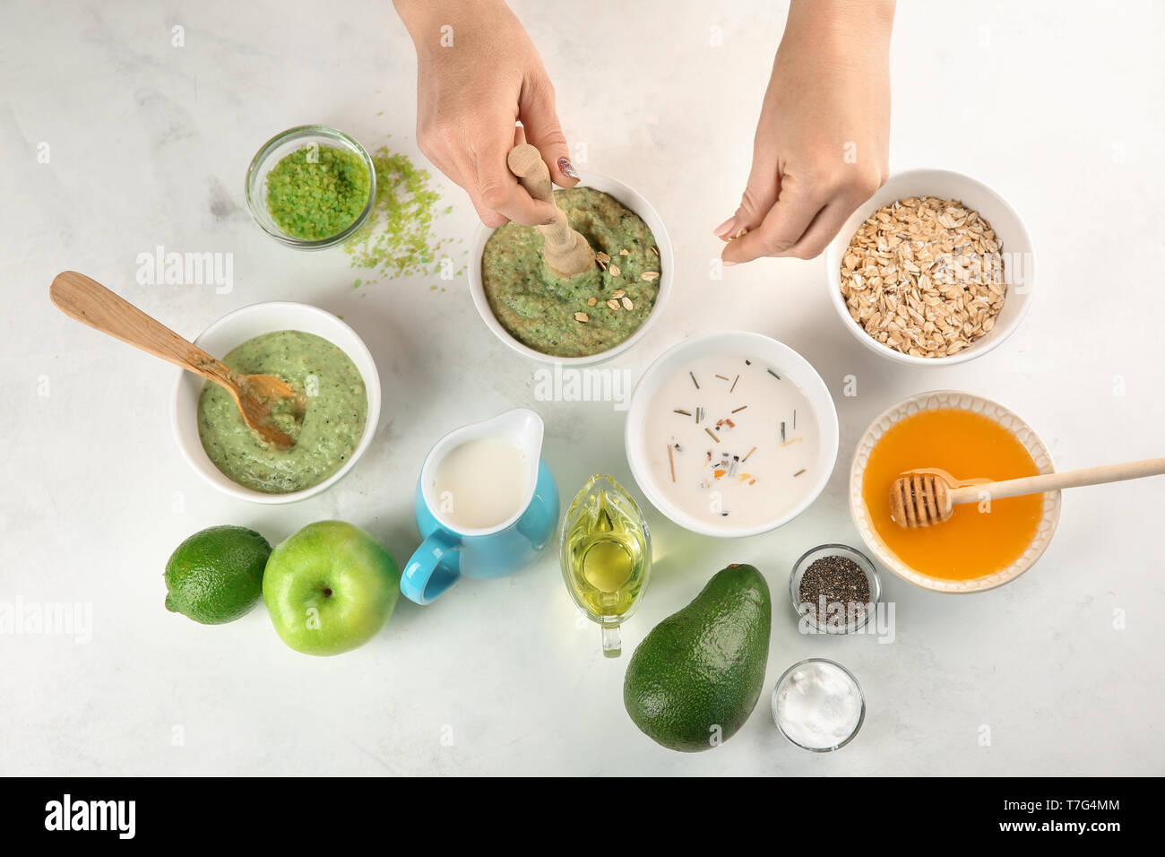 Woman making nourishing mask with avocado Stock Photo Alamy