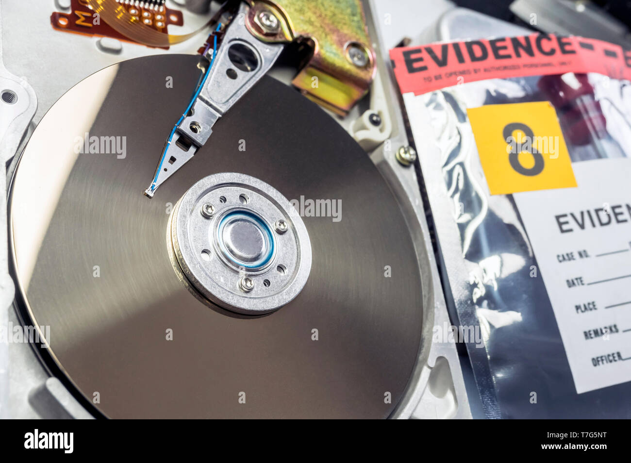 Hard disk opened in criminological laboratory, conceptual image Stock Photo