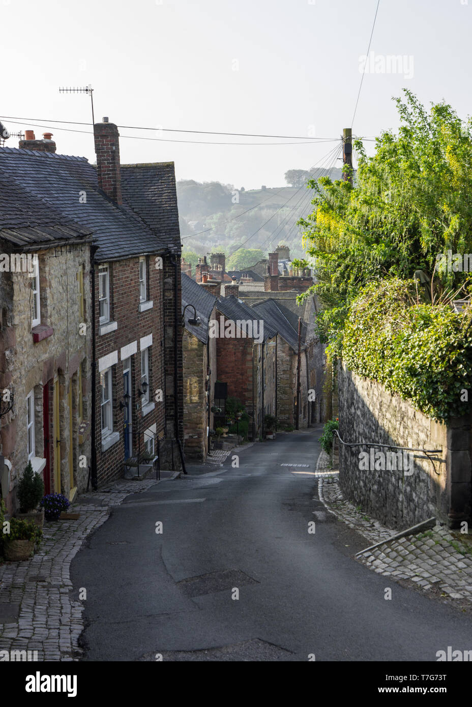 old cottages along the puzzle gardens on Wirksworth town, Derbyshire Peak district UK Stock Photo