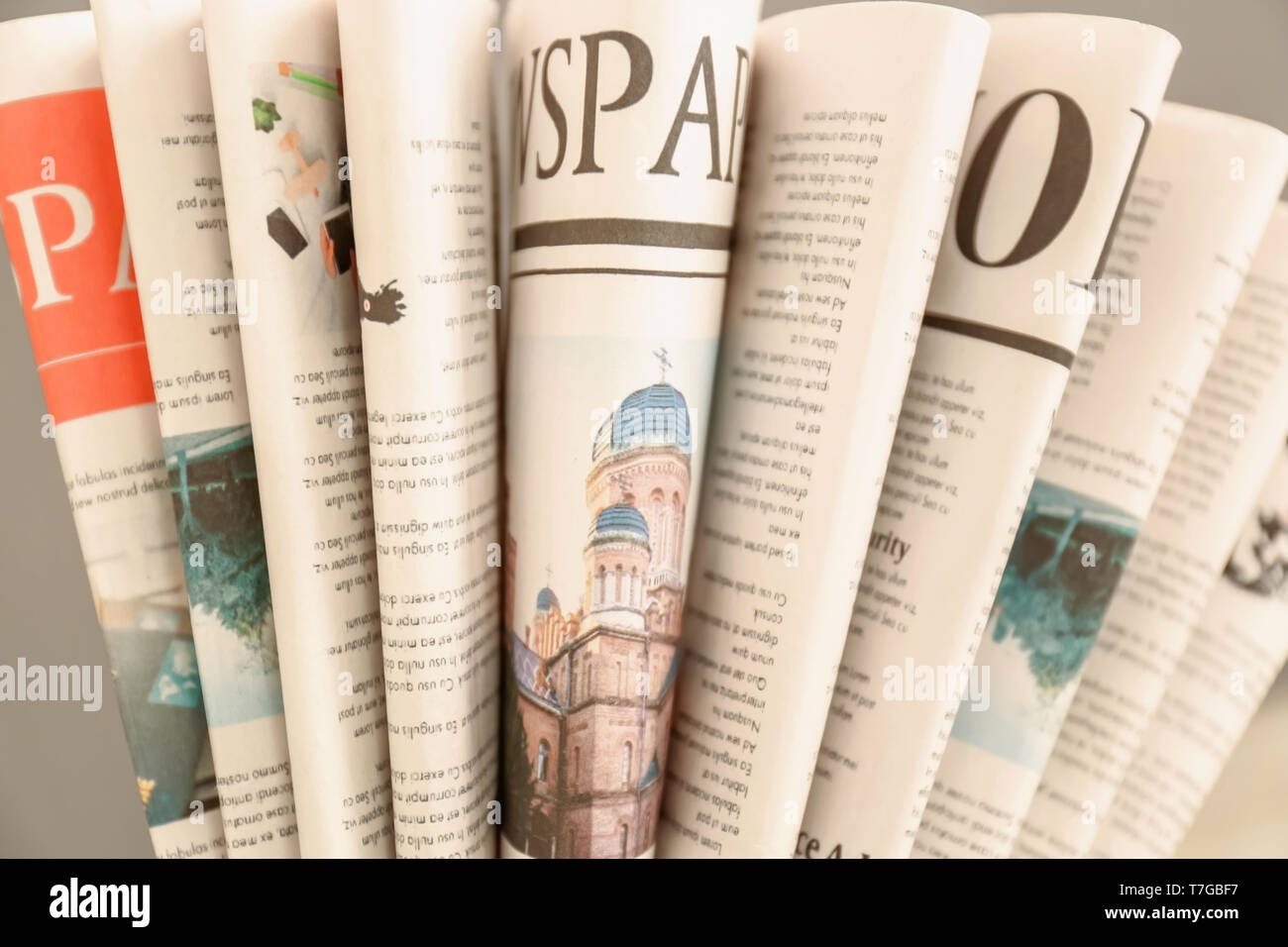 Various folded newspapers, closeup Stock Photo - Alamy