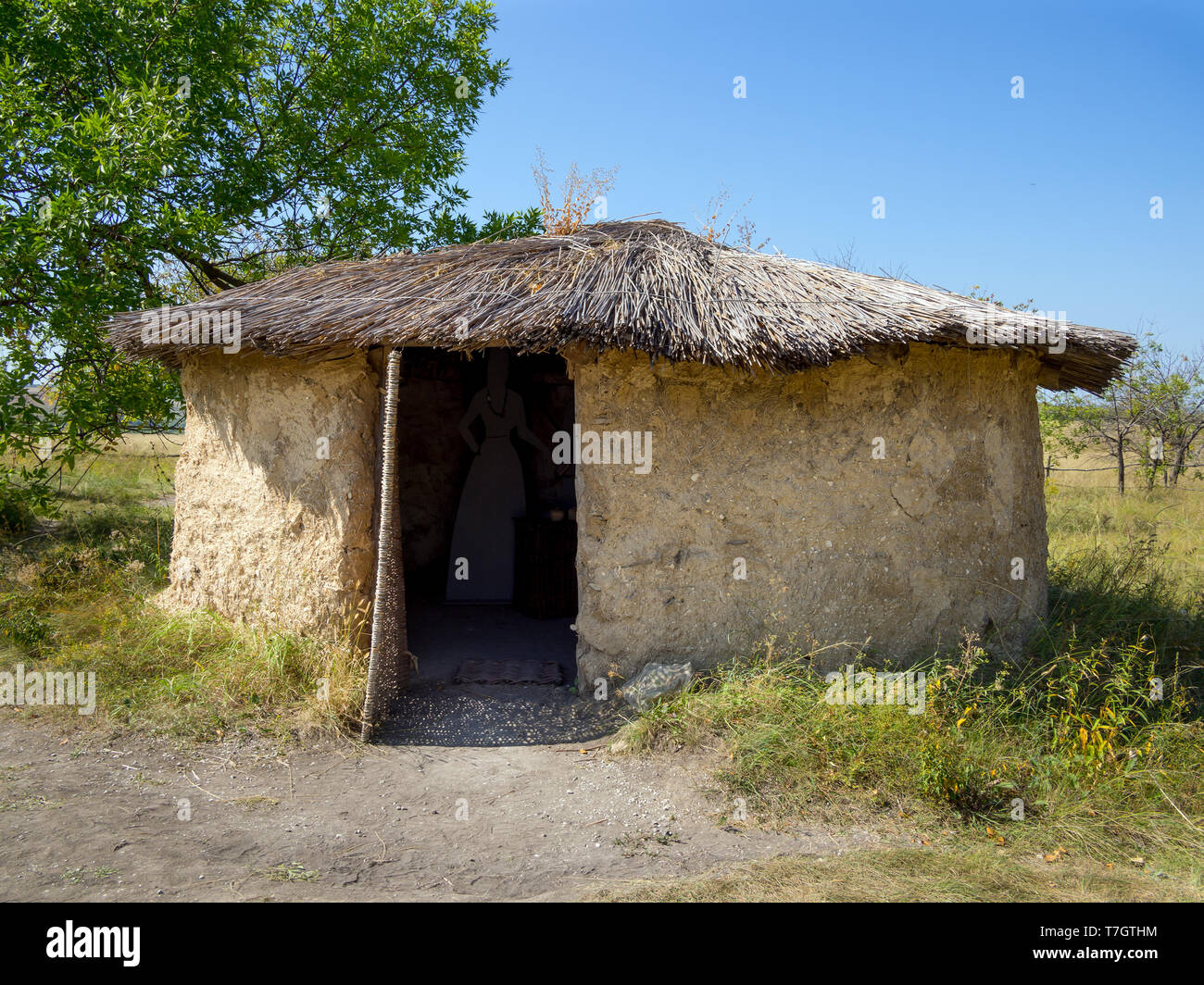 Mud hut with a reed roof, archaeological park 'From nomadic to cities', Divnogorye, Voronezh region Stock Photo