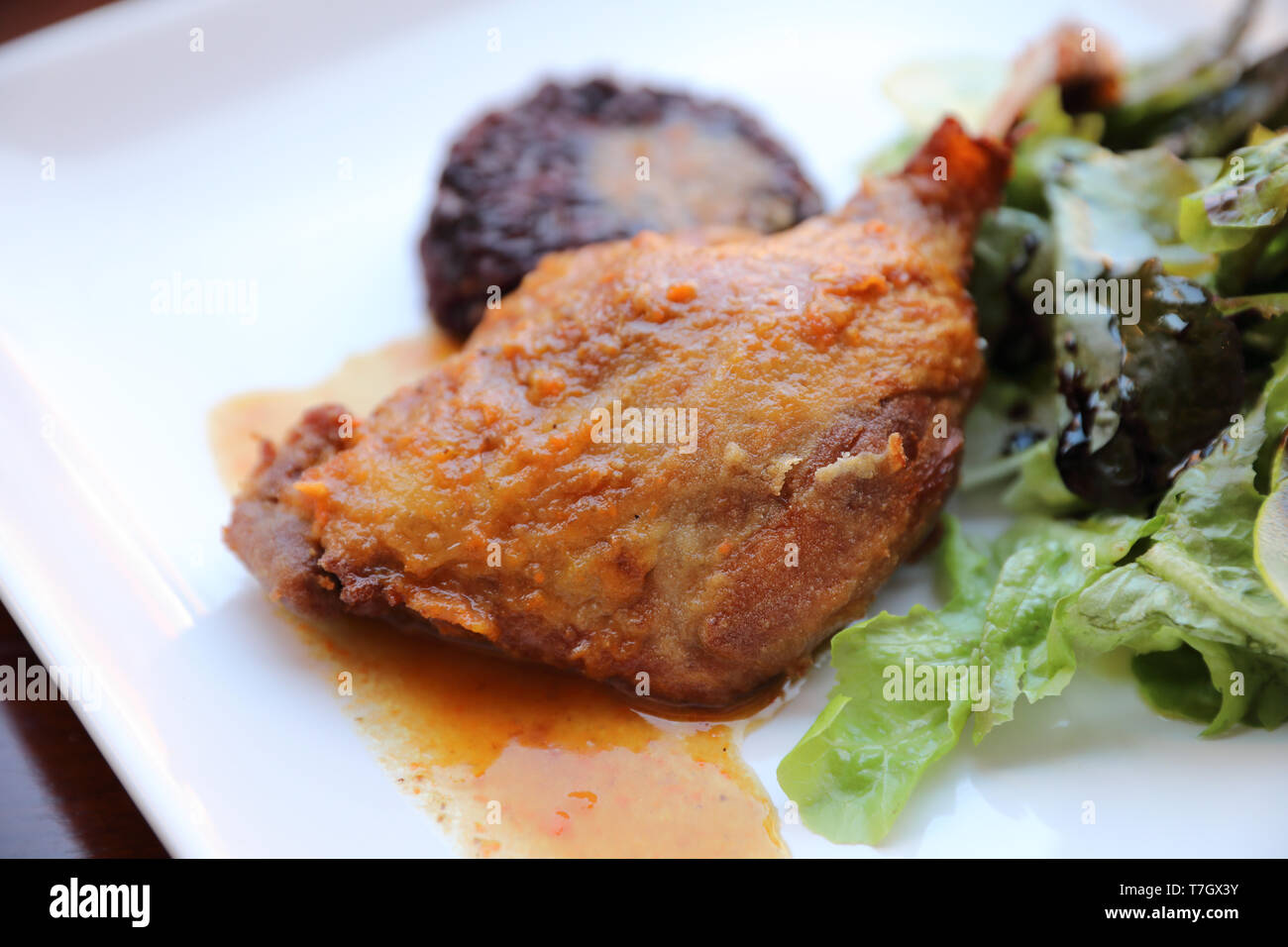 duck confit with rice and salad , italian food style Stock Photo Alamy