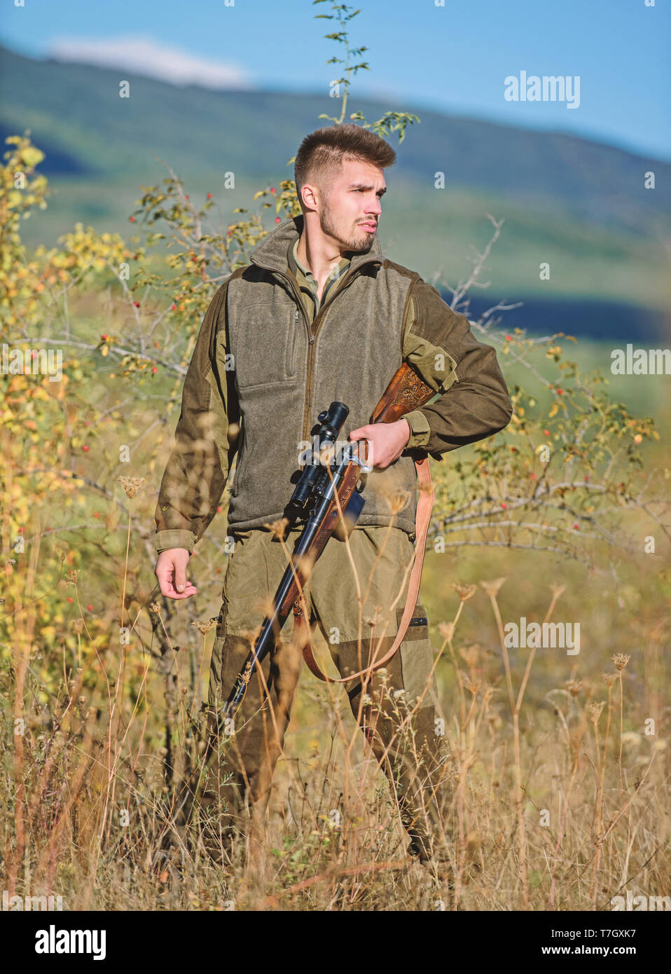 Hunter brutal poacher. Hunter bearded poacher looking for victim