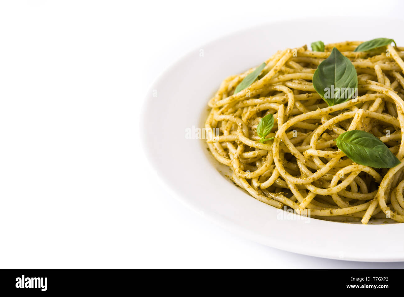 Spaghetti pasta with pesto sauce isolated on white background Stock Photo