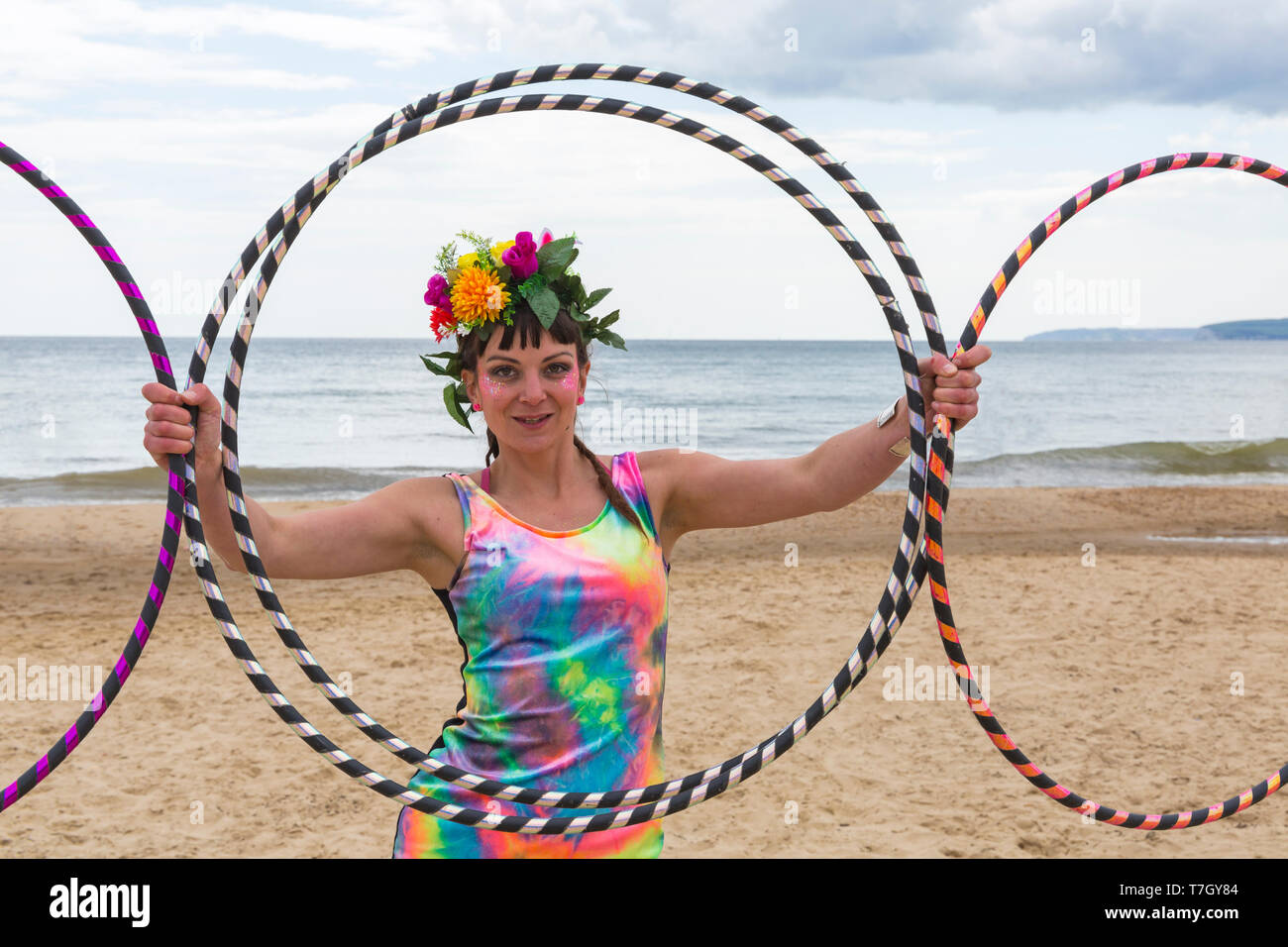 Lottie Lucid with her hula hoops on Boscombe Beach, Bournemouth, Dorset UK in May Stock Photo