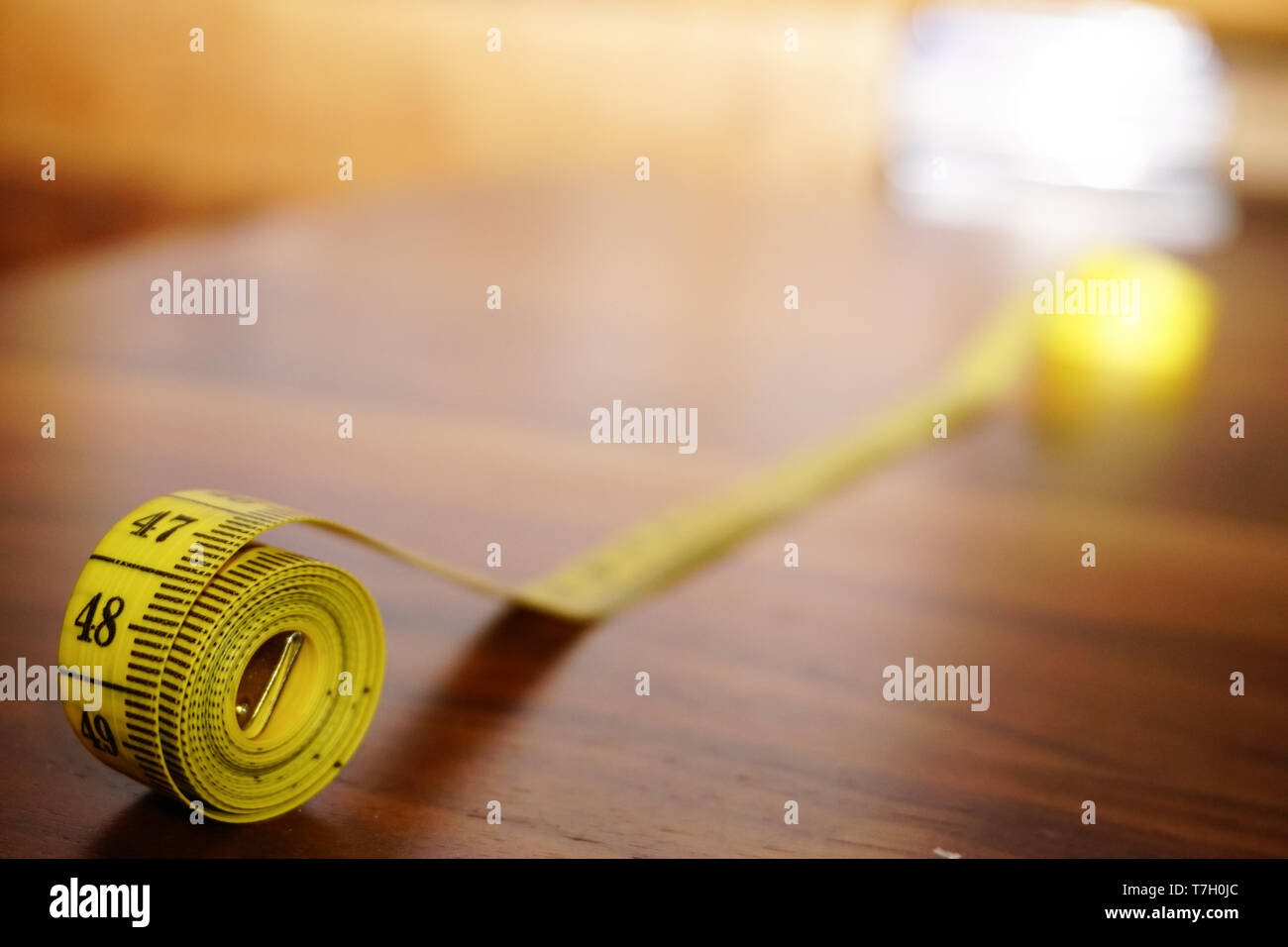 Rolled measuring tape close up view Stock Photo