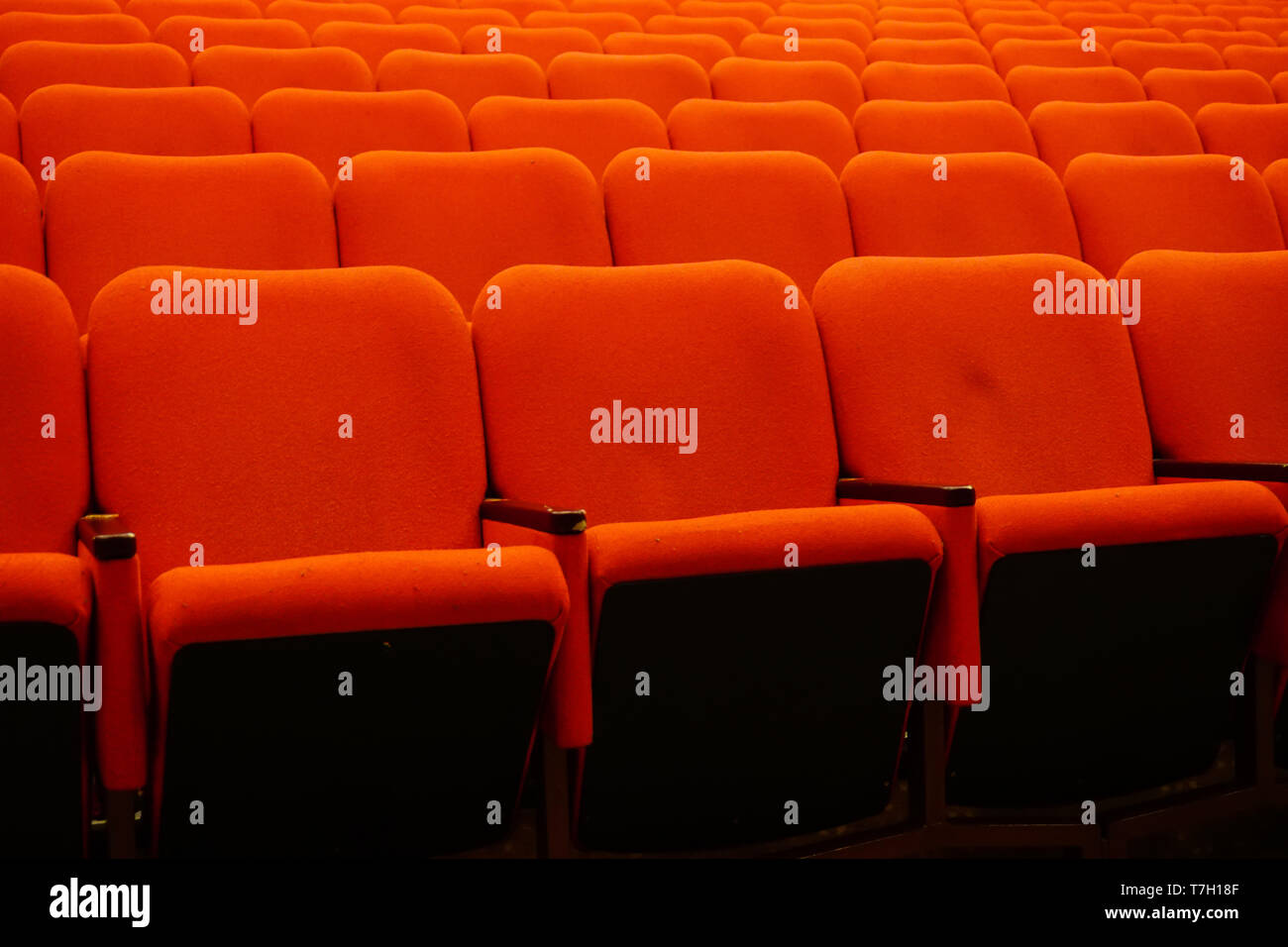 Red theater seats in a row Stock Photo