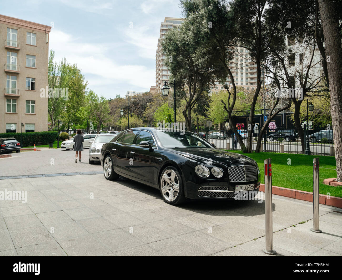 Baku, Azerbaijan May 2, 2019 Luxury Bentley black car parked in front of Hyatt hotel in