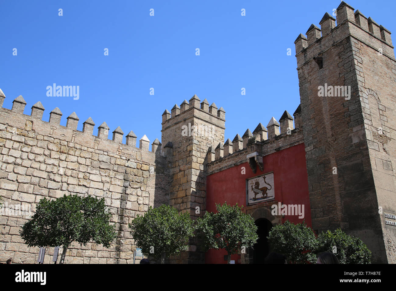 Spain. Andalusia. Seville. Royal Alcazar. Exterior wall and the Lion Gate or Gate of the Hunt. Stock Photo