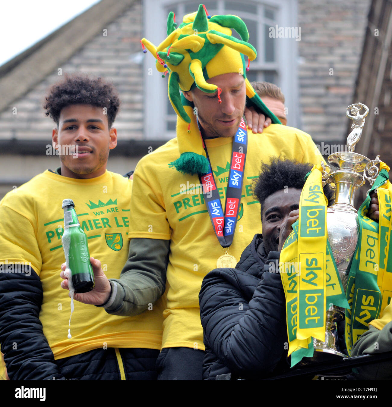 Onel Hernandez (left), Marco Stieperman (middle), and Alex Tettey (right) with the EFL Championship Trophy, Norwich City promotion parade 2019 Stock Photo