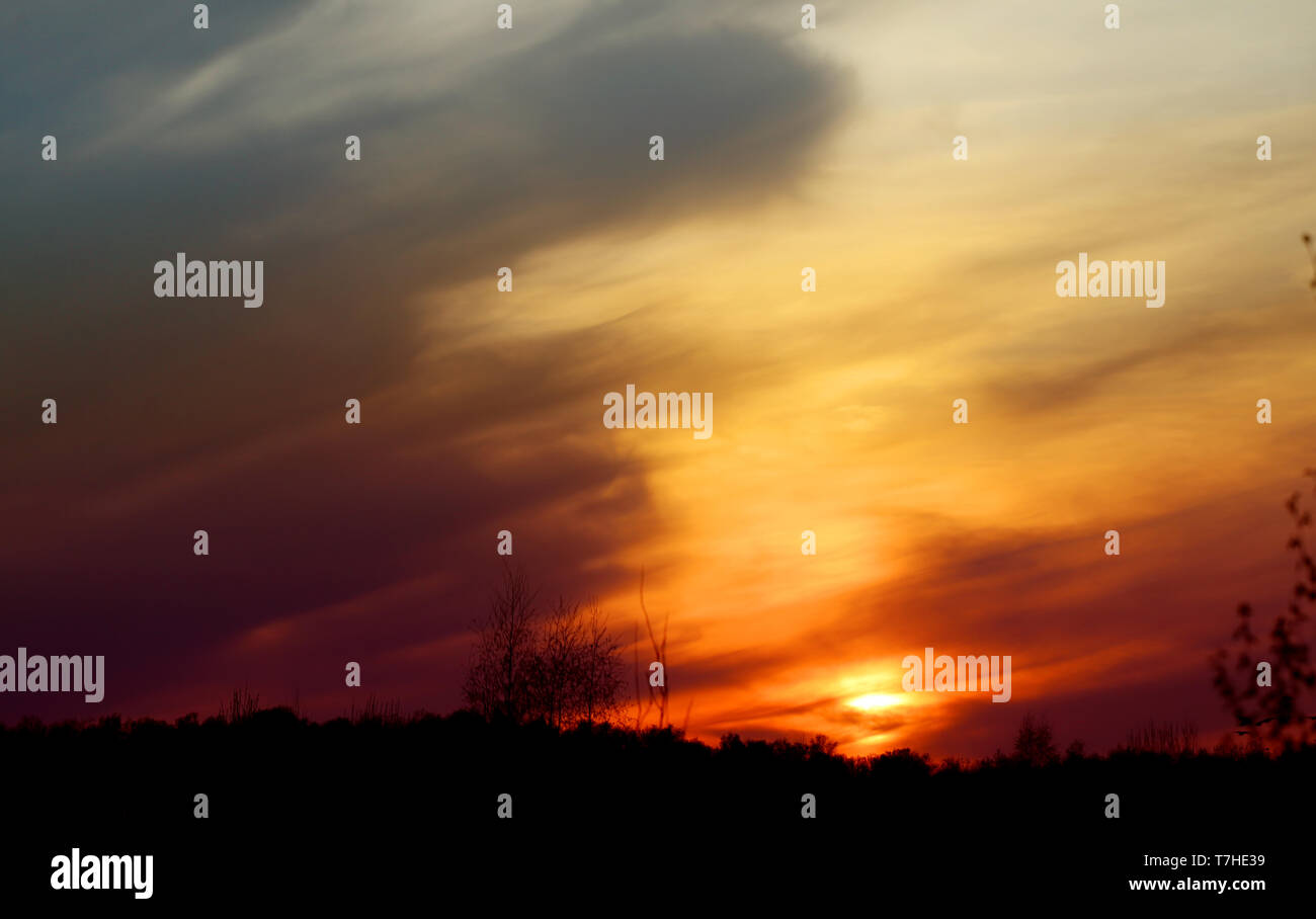 Spring evening sunset photo with clouds Stock Photo