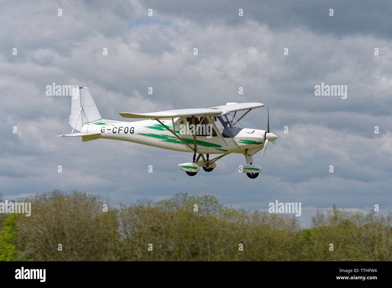 Ikarus C42 kit plane G-Cfog coming into land at Popham Airfield in Hampshire during the spring microlight fly-in event Stock Photo