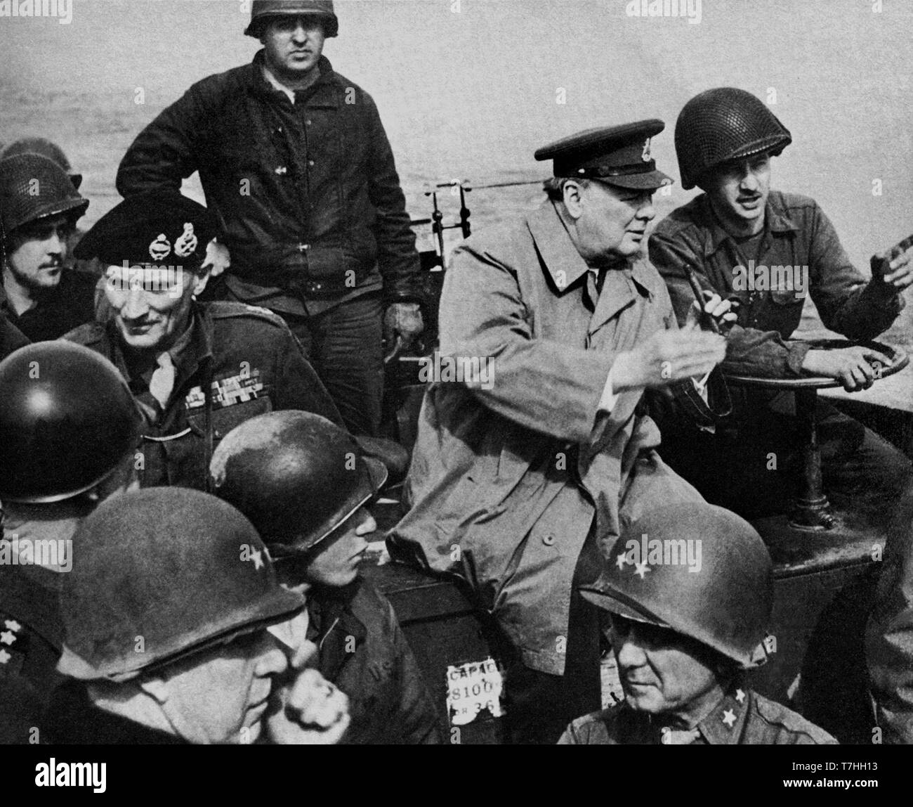Winston Churchill with General Montgomery crossing the River Rhine aboard an American landing craft. 25th March 1945 Stock Photo