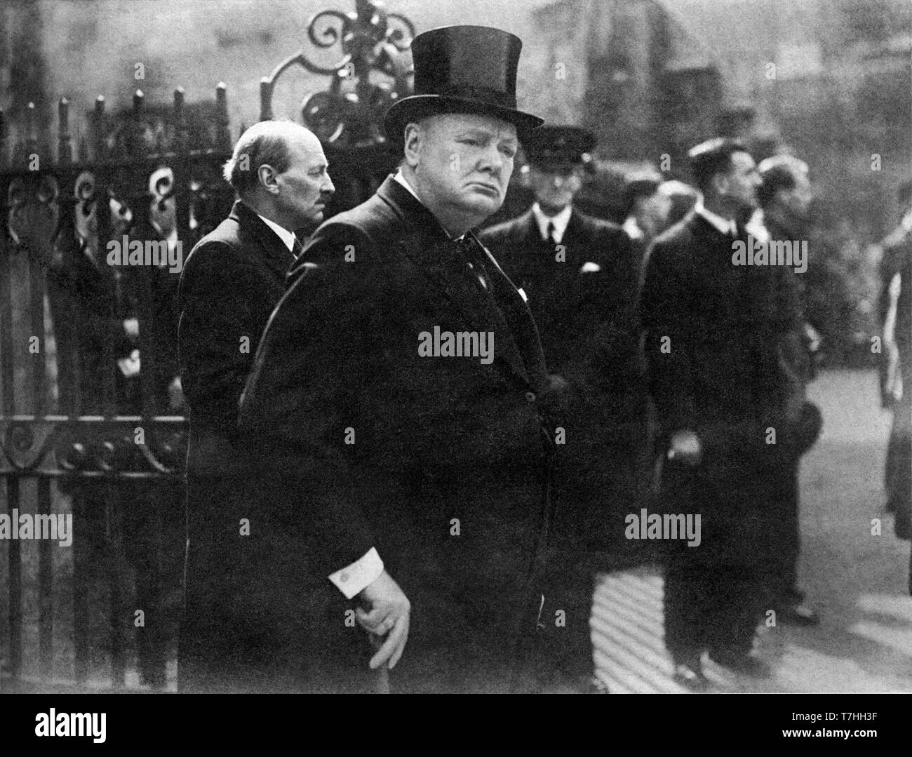 Winston Churchill leaving Westminster Abbey with Clement Attlee after Lloyd George's memorial service. 11th April 1945 Stock Photo