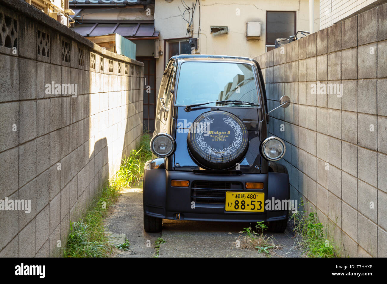 Daihatsu Midget II Japanese small city car. mini cars parking in a narrow alley at the house in Tokyo, Japan. Daihatsu Midget II second generation, th Stock Photo