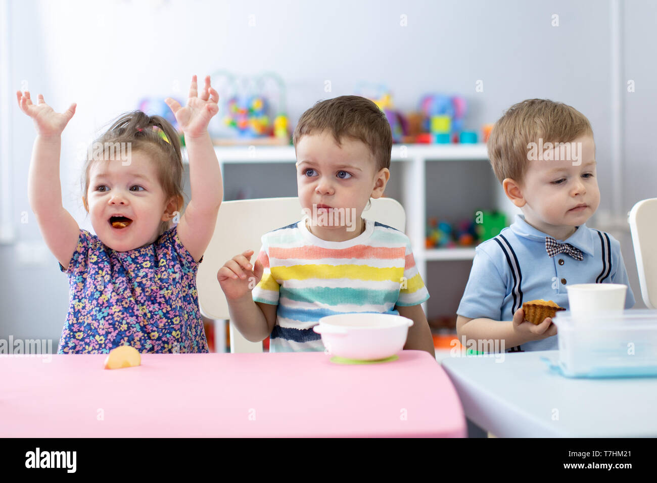 Group of children have a lunch in daycare centre. Kids eating in