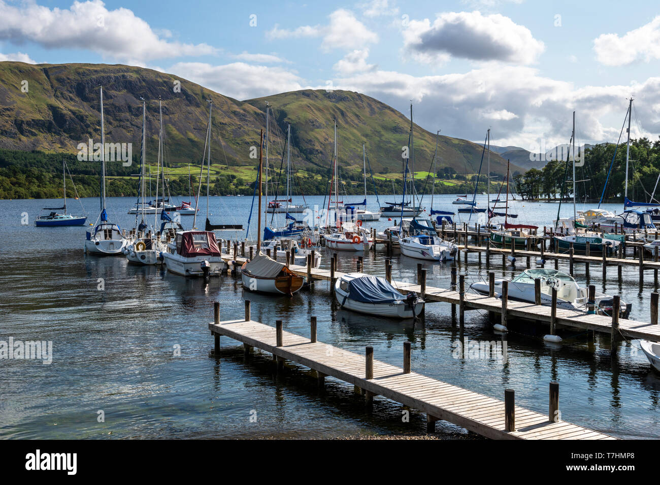 Yachts moored on pontoons at Fair Field Marina on Ullswater in the Lake District National Park, Cumbria, England, UK Stock Photo