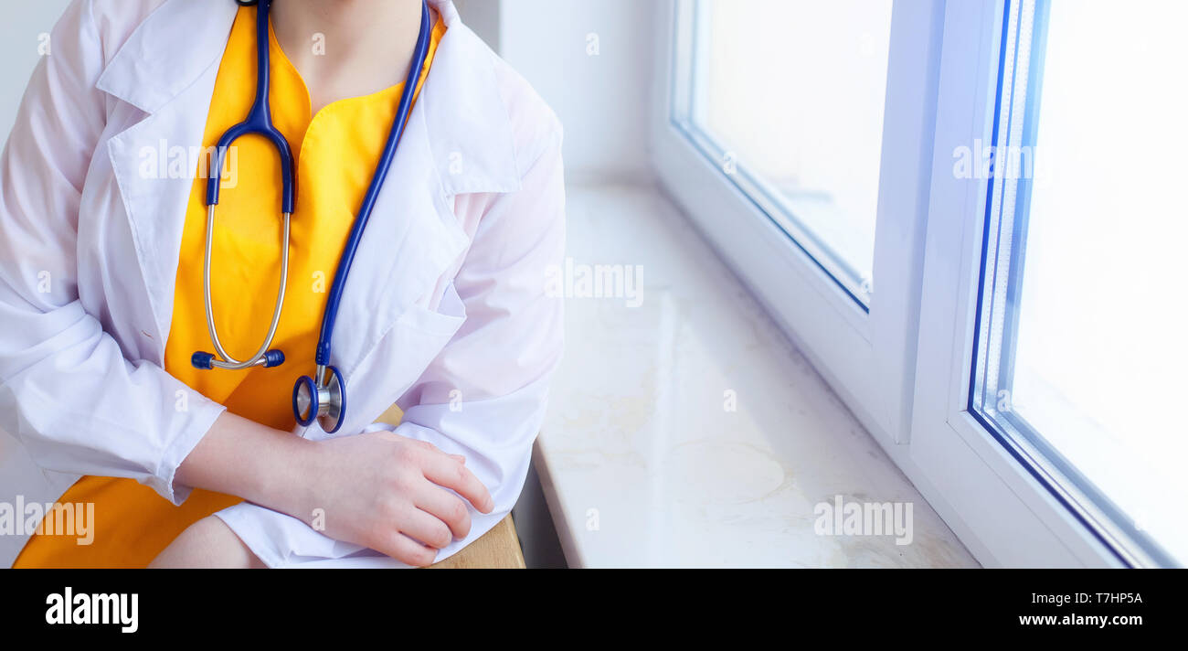 medicine. Female Doctor in the Hospital faceless background. Stock Photo