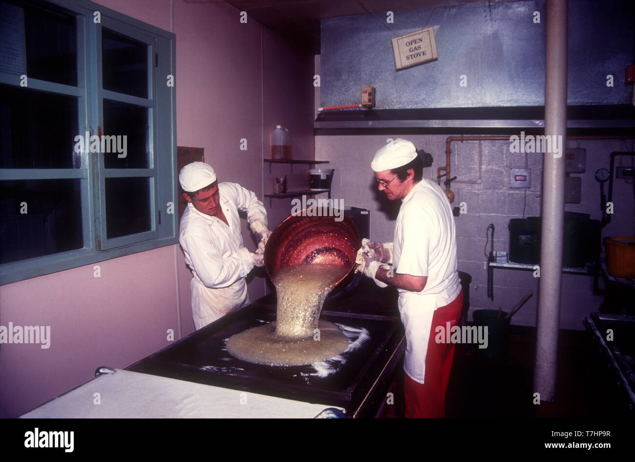 Worlers Pour The Hot Mixture Of Sugar And Glucose Syrup Onto