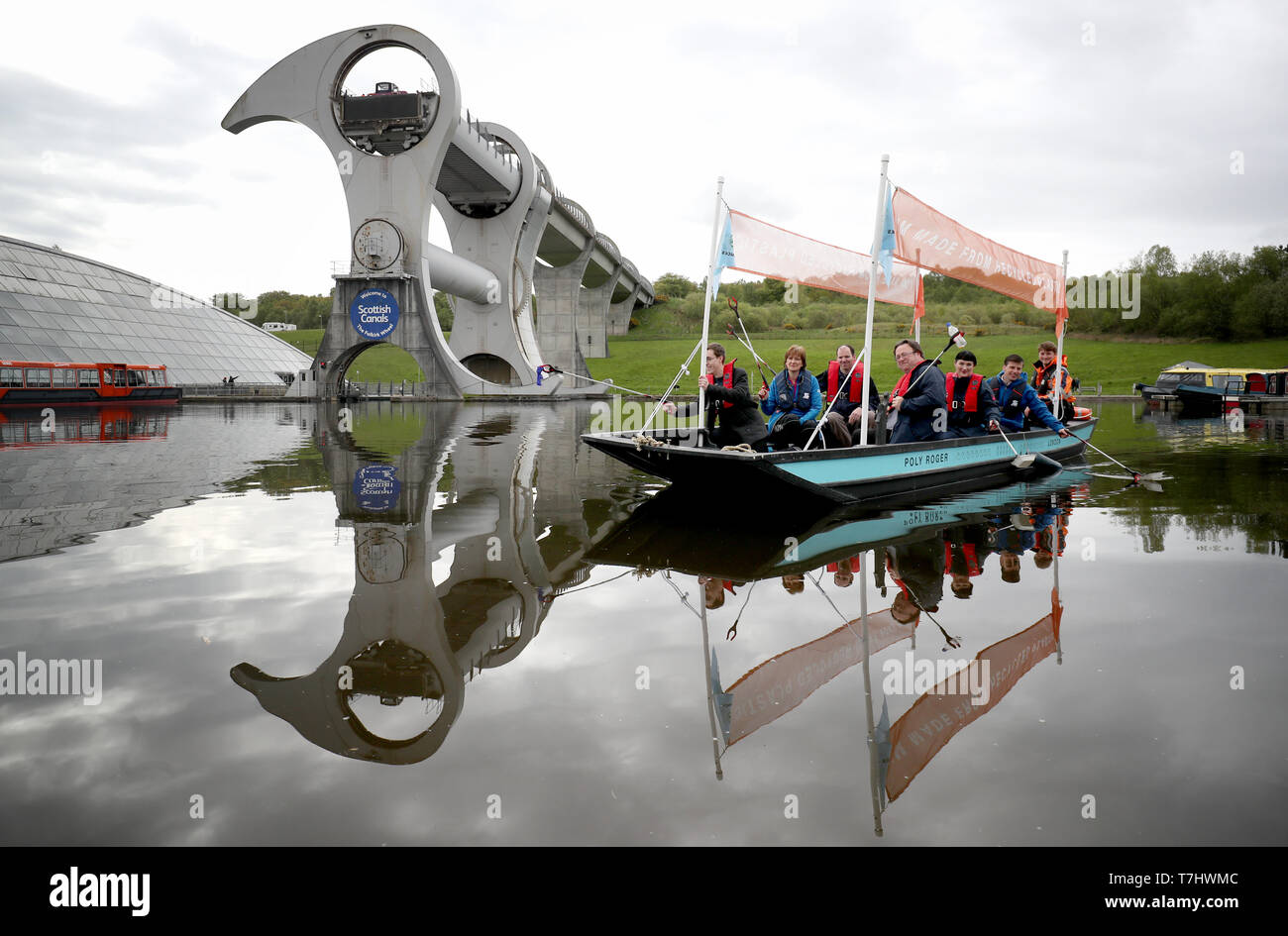 A plastic fishing boat created by environmental charity Hubbub and made of 99% recycled plastic is launched on the canal at the Falkirk Wheel, before traveling around Scotland to raise awareness of pollution in the country's waters. Stock Photo