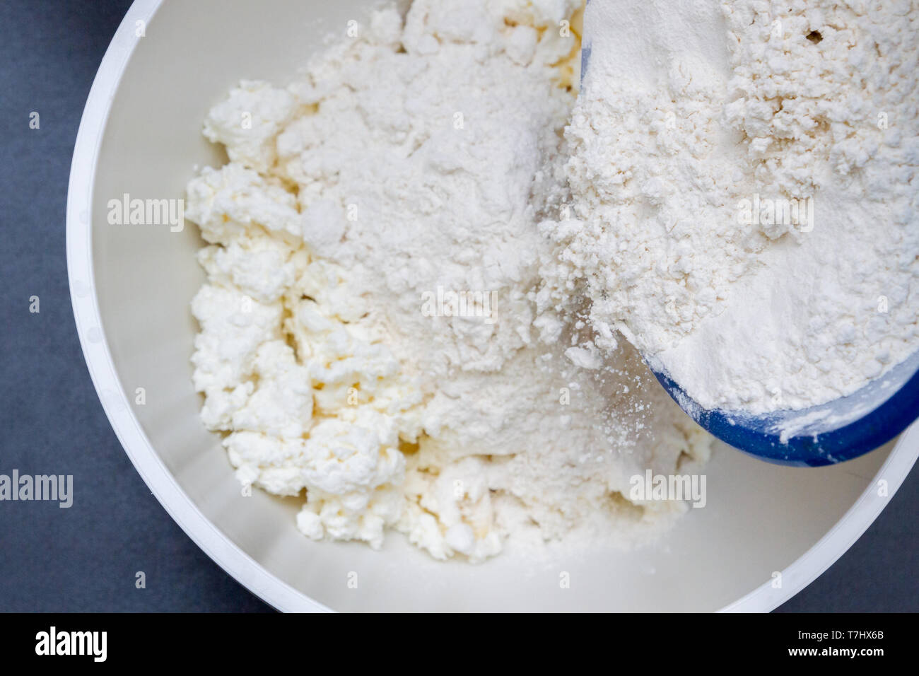 In A Bowl With Ingredients Butter And Cottage Cheese For Biscuits